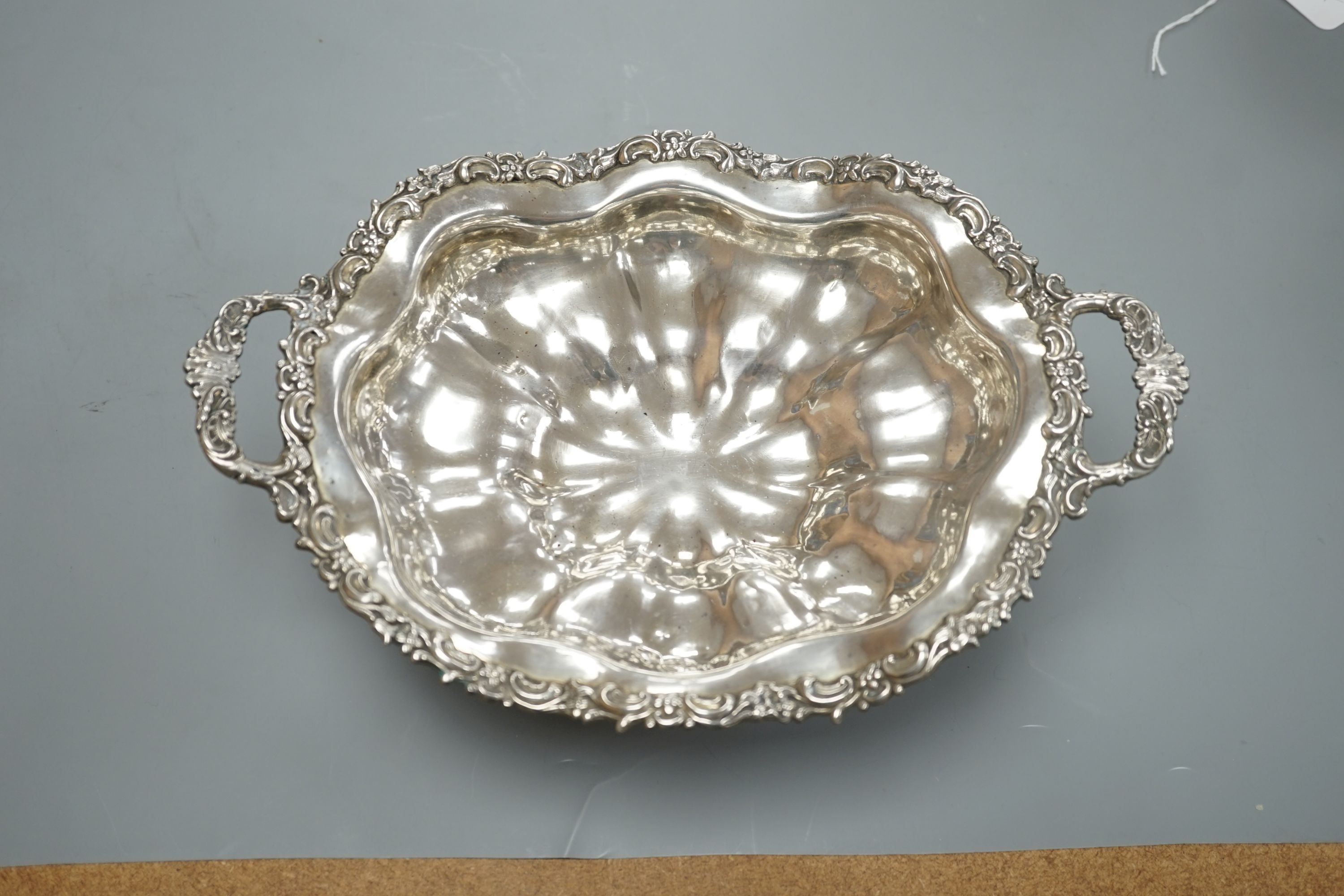 A 19th century Russian 84 zolotnik embossed tow handled fruit bowl, assay master, Dmitri Tvyersko?, 1846, master G.F.R., width, 30.2cm, 12oz.